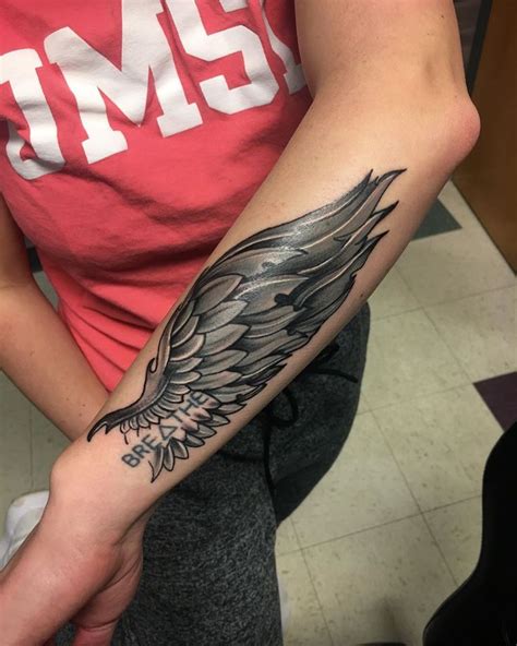 red wing tattoo meaning - Christian Garber