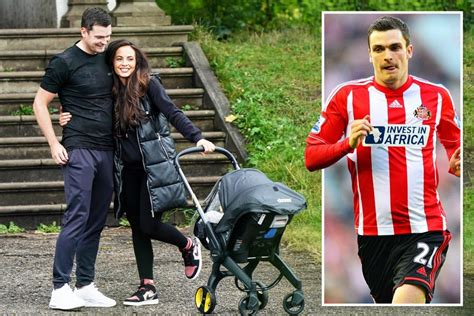 Disgraced footballer Adam Johnson and girlfriend take daughter and newborn son out for a walk