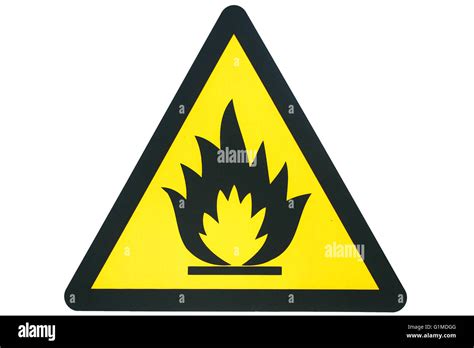 A triangular flammable gas or fire sign in yellow and black isolated on white Stock Photo - Alamy