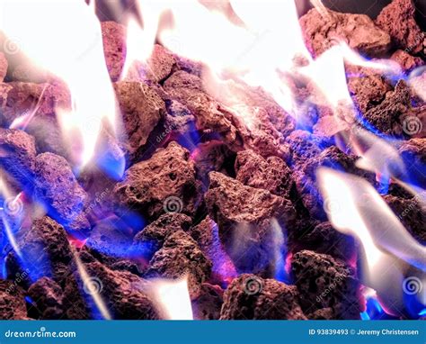 Propane Fire Pit Closeup Flames in Lava Rocks Stock Image - Image of closeup, blue: 93839493