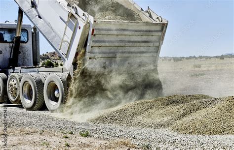 Dump Truck spreading Gravel on Driveway Stock Photo | Adobe Stock