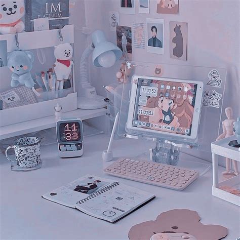 a desktop computer sitting on top of a desk next to a clock and other items