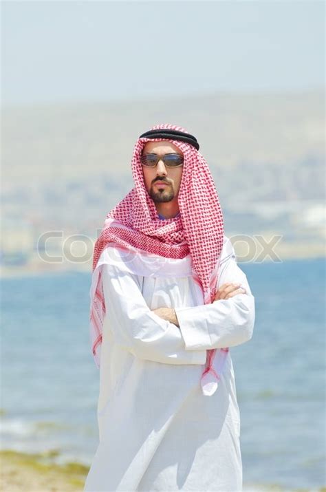 Arab on seaside in traditional clothing | Stock Photo | Colourbox