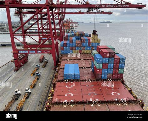 Hatch covers of the container vessel partly loaded with containers ...