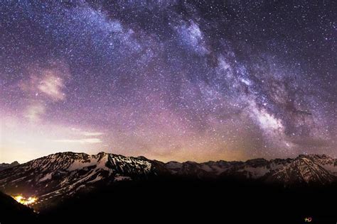 Snowy Mountains under Starry Sky 4K wallpaper download