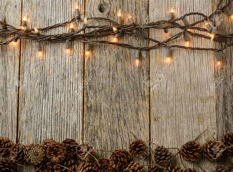 Christmas Lights and Pine cones on Rustic Wood Background | Rustic wood background, Rustic ...