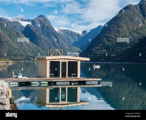 Floating sauna, village Fjaerland at the Sognefjord, glacier Jostedalsbre in the back, Norway ...