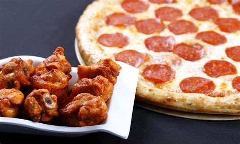 Pizza, Wings, and Calzones - Simple Simon's Pizza | Groupon