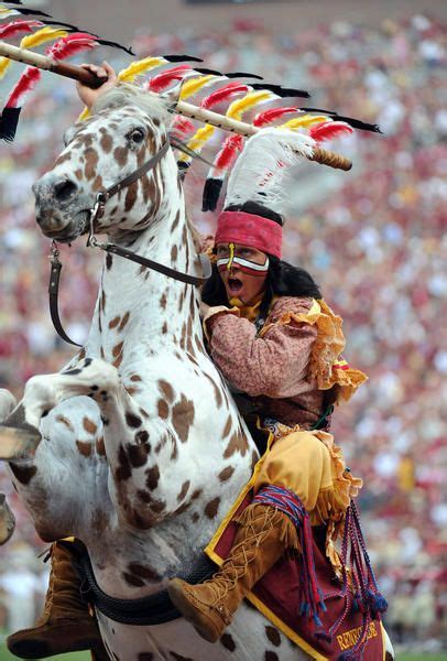 Florida State Seminoles mascot Chief Osceola rears the horse Renegade ...