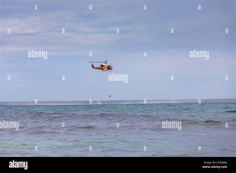 Rescue helicopter training over sunny ocean, Adelaide, Australia Stock ...