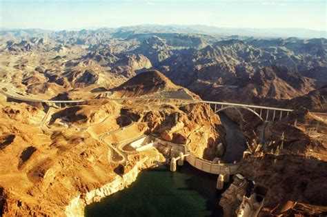 Aerial shot of the terrific Hoover Dam and Hoover Dam Bypass Bridge - Photorator