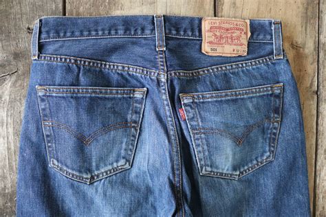 Vintage Levis Levis Strauss 501 blue denim jeans 30 x 29 workwear red tab small e