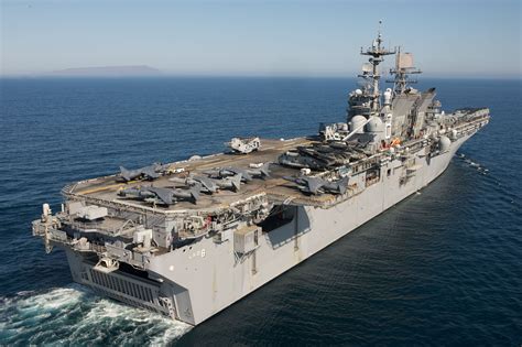 The amphibious assault ship USS Makin Island (LHD 8) conducts flight deck operations in the ...