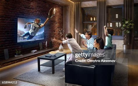 Family With Children Watching American Football Game On Tv High-Res ...