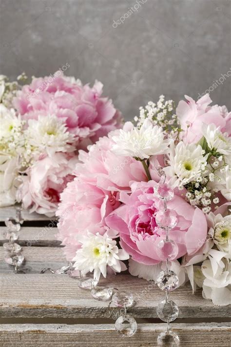 Floral arrangement with pink peonies, white chrysanthemums and g ...