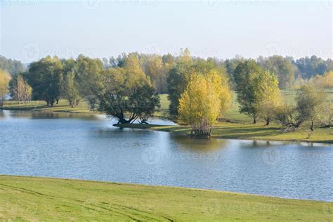 autumn landscape with a river 7422875 Stock Photo at Vecteezy