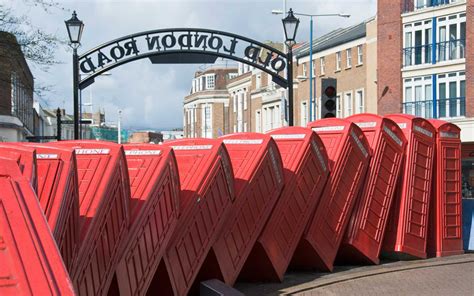 London's Famous Tumbling Phone Booth Sculpture Has Been Refurbished to ...