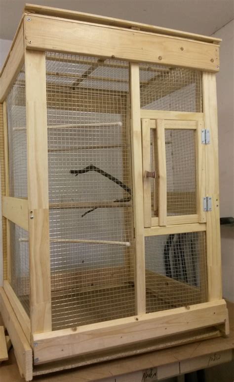 Made mostly from scrap wood in my warehouse bird cage for my African Grey to use on the weekend ...