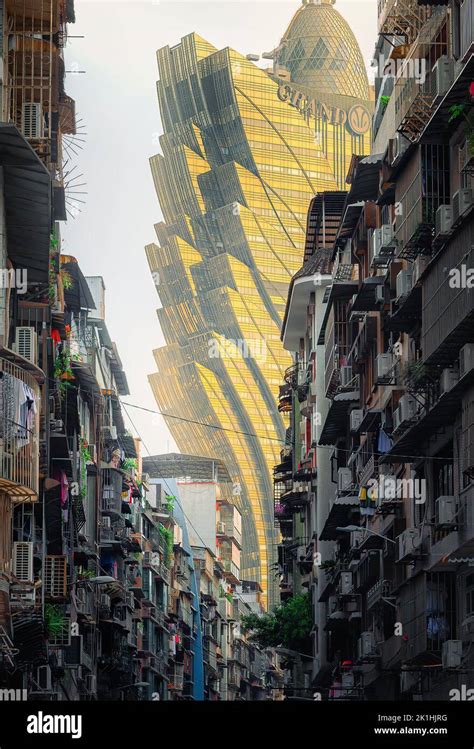 A vertical shot of grand Lisboa Macau architecture from the slums in Macau city, China Stock ...