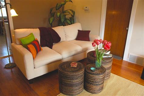 Peggy's Zen living room makeover, white sofa, pink tulips, bright pillows, maroon throw, natural ...