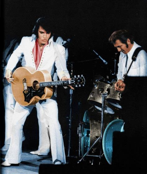 Elvis Presley performing with James Burton in Oakland, CA