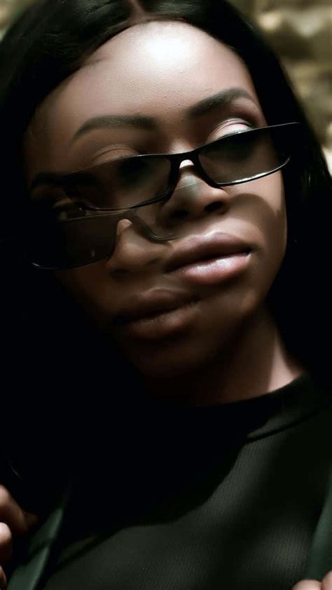 Download Nigerian Woman With Sunglasses Wallpaper | Wallpapers.com