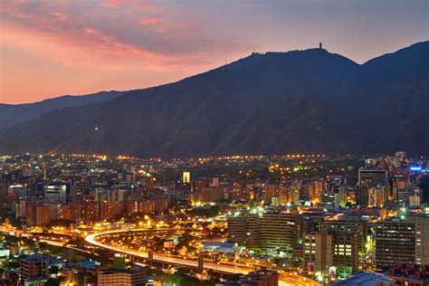 Aerial View of City Buildings Near Mountain during Night Time · Free ...