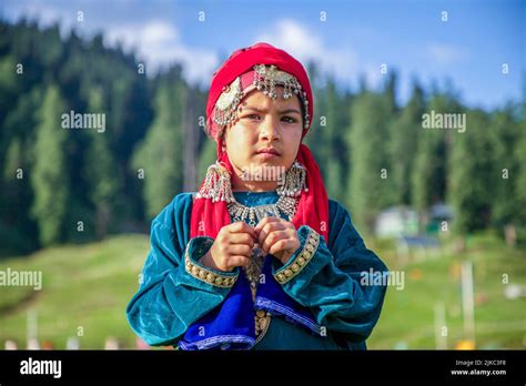 Srinagar, India. 30th July, 2022. A girl dressed in a traditional ...