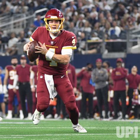 Photo: Washington Football Team quarterback Taylor Heinicke scrambles ...