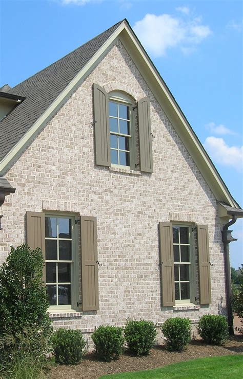 The side of a brick home can be just as dramatic as the front. Add a segmental arch and brick ...