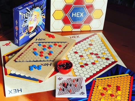 the board game hex is next to its box and some other games are on the table