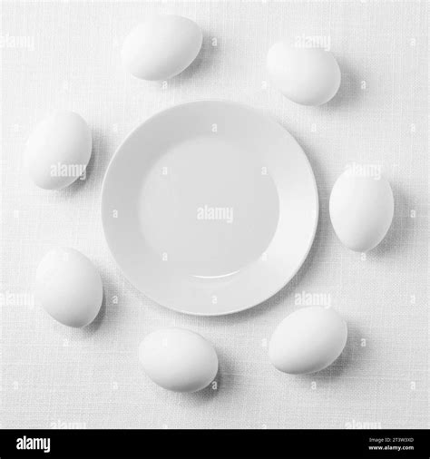 Top view white chicken eggs table with plate Stock Photo - Alamy