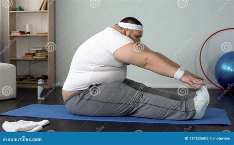 Obese Male Lifting Leg Lying On Mat, Healthy Lifestyle, Sport Leisure ...