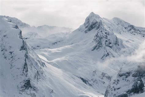 Severe cold winter landscape with snowy rocky mountain peaks and ...