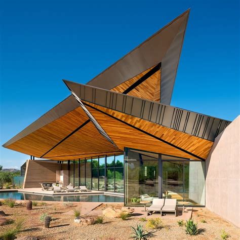 Expansive angled roofs crown this desert house by Arizona firm @kendledesign, protecting and ...