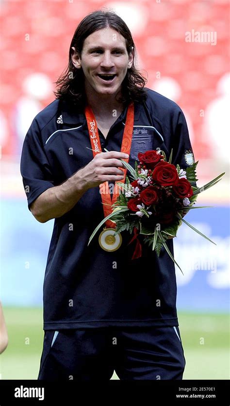 Argentina's Lionel Messi celebrates his victory the Olympic Football competition at the Men's ...