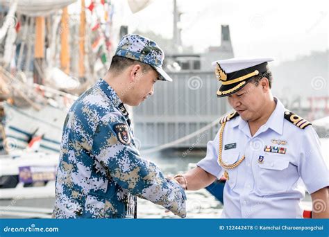 Royal Thai Navy Officer in White Uniform Shakes Hand with PLAN Officer in Blue Digital ...