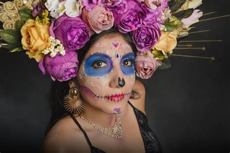 Premium Photo | Studio portrait of a girl with catrina makeup looking ...