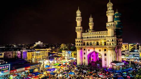 High angle view of illuminated Charminar amidst market at night. - Bing Gallery