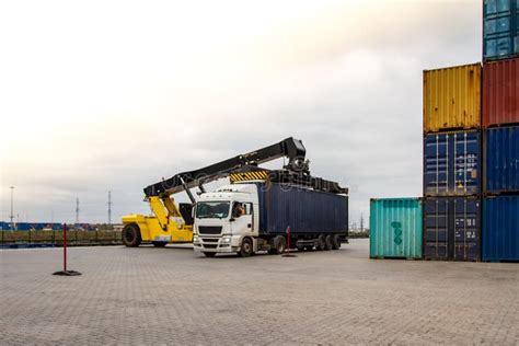 Forklift Handling Cargo Container. Freight Container Loading Stock ...