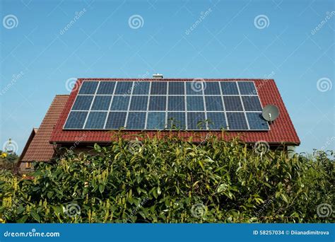 Solar panels on a red roof stock photo. Image of cells - 58257034