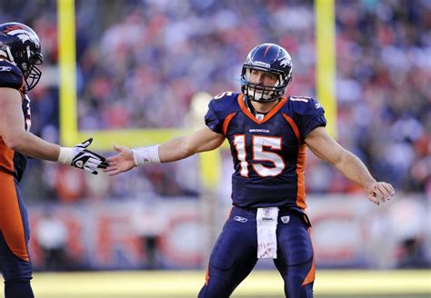 Quarterback Tim Tebow (15) celebrates a score during an NFL game against the New England ...