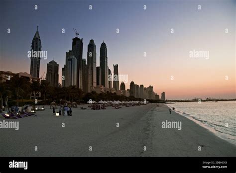 Dubai beach. Skyline in sunset time, United Arab Emirates Stock Photo - Alamy