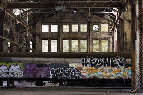 Abandoned Warehouse and Graffiti Covered Train