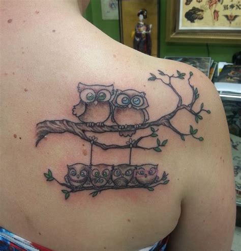 I really like the amount of work that went into this tattoo of an owl family. There's so much ...