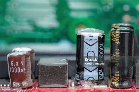 Damaged Capacitor On A Circuit Board Stock Photo - Download Image Now - Capacitor, Exploding ...