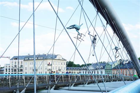 Walking along the Vistula River in Krakow and art on a bridge