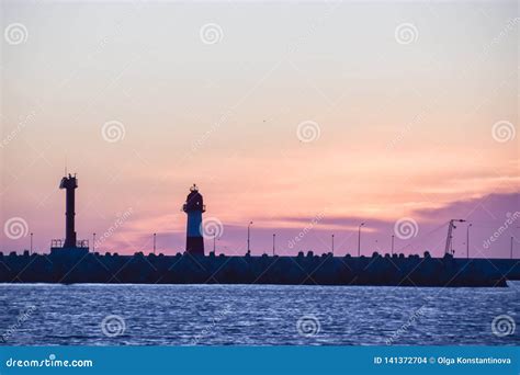 Lighthouse Silhouette and Setting Sun Sunset Red Sky Clouds Stock Photo - Image of beautiful ...