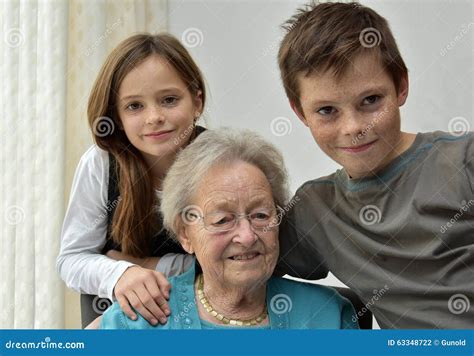 Grandma and grandchildren stock photo. Image of conversation - 63348722