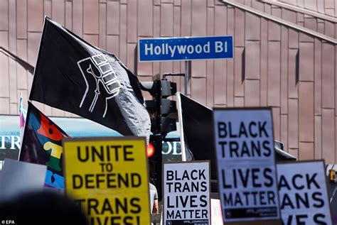 Giant 'All Black Lives Matter' slogan is painted in rainbow colors along Hollywood Boulevard ...